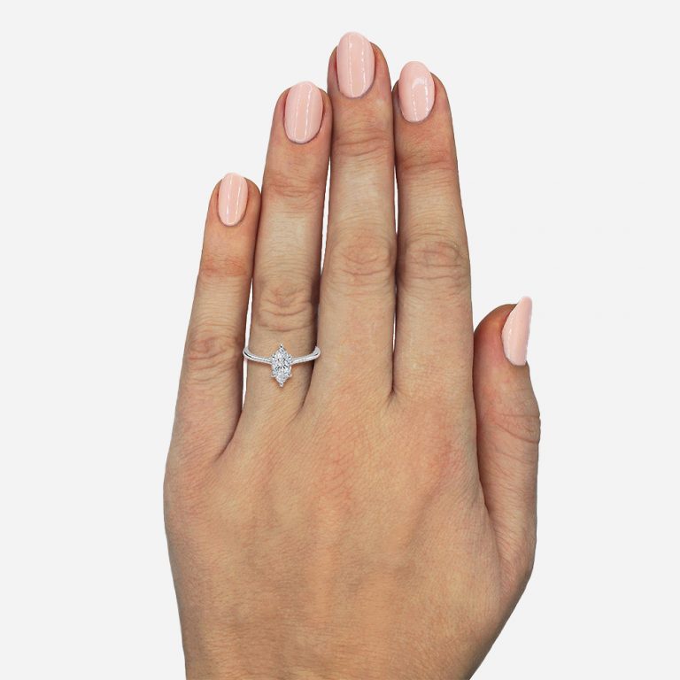 marquise cut engagement rings with hidden halo on hand